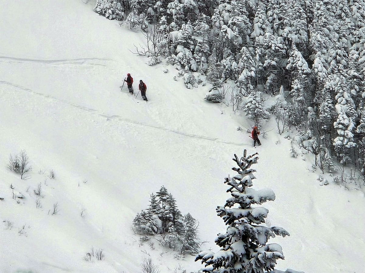 Ski patrol inspecting the slides and cutting tracks across the fall line to check for instability. 📷 Bill Brudvig  